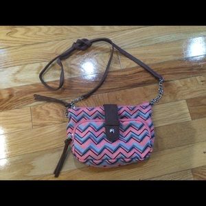 Crossbody coral pocketbook.